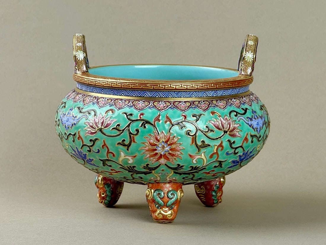 An Exquisite Turquoise Ground Enamel Painted Gold Lotus and Bats Pattern Double-Ears Tripod Censer: An Exquisite Turquoise Ground Enamel Painted Gold Lotus and Bats Pattern Double-Ears Tripod Censer,Qing Dynasty,China,Qianlong Six-character Mark,Size:4.8inx5.8inx3.3in松石绿地