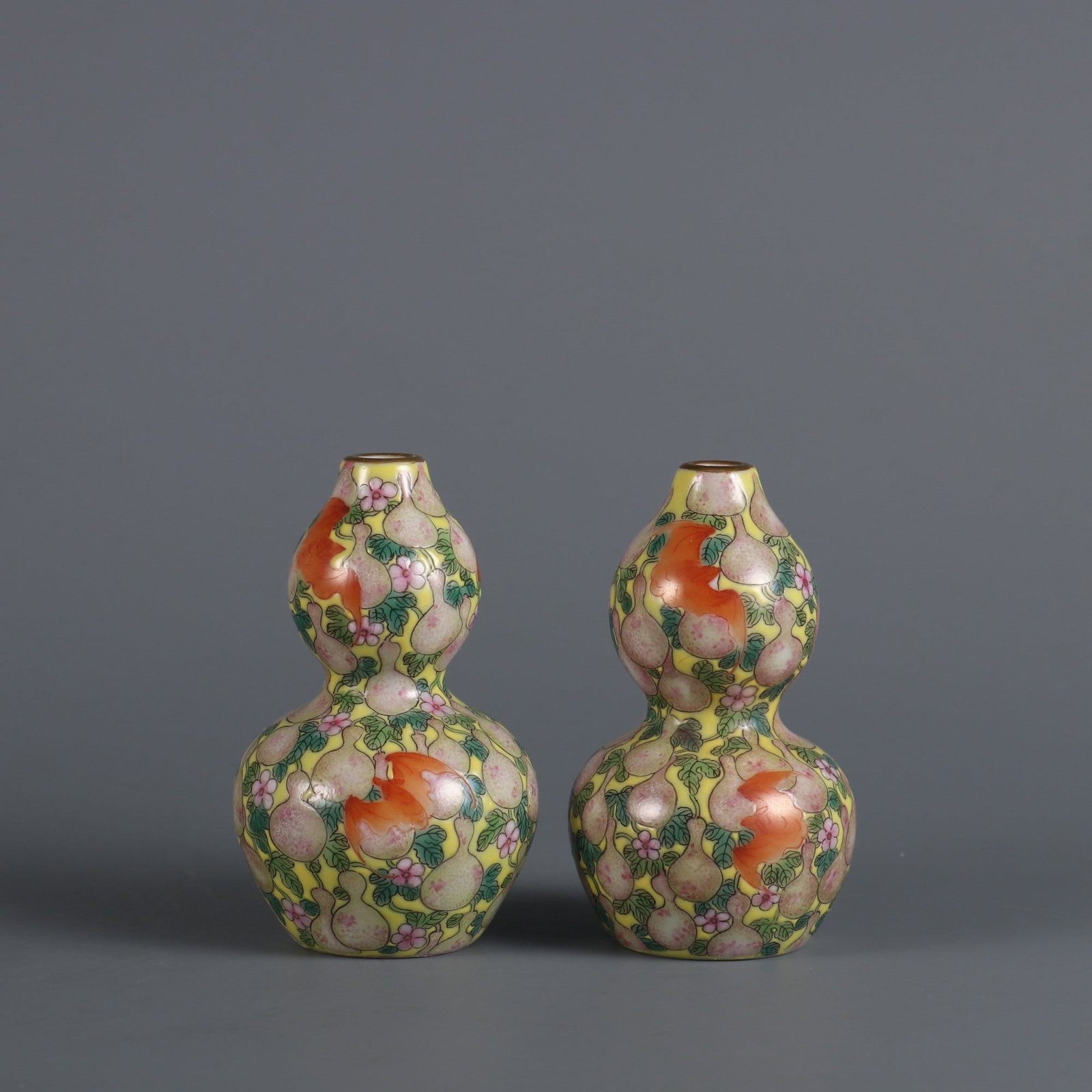 A Pair of Exquisite Yellow Ground Famille-Rose Bats and Gourd Pattern Gourd-Shaped Vases: A Pair of Exquisite Yellow Ground Famille-Rose Bats and Gourd Pattern Gourd-Shaped Vases,Qing Dynasty, China,Qianlong Four-character