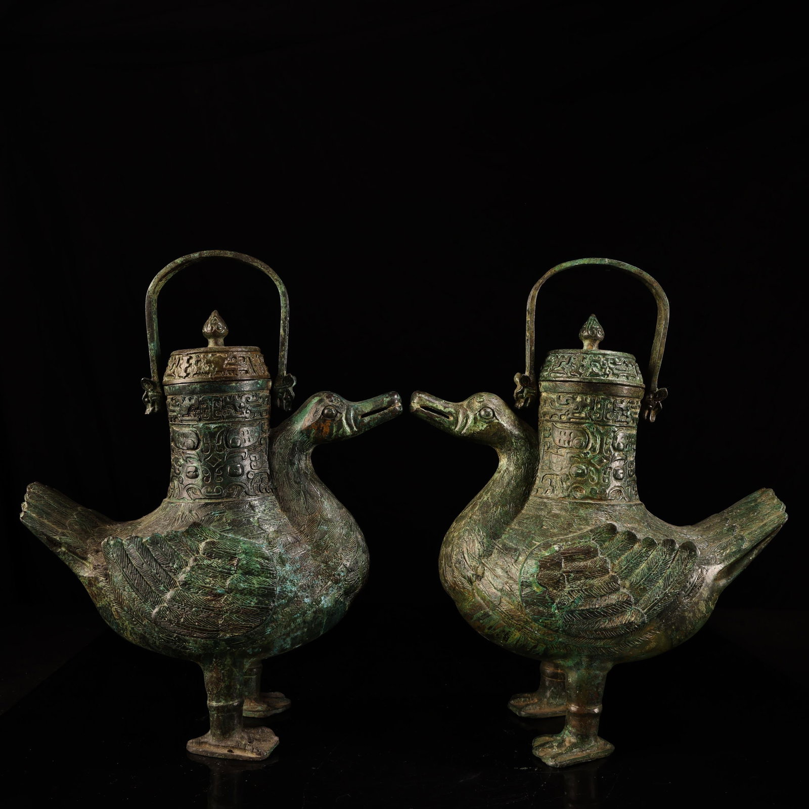 A Pair of Archaic Bronze Beast-Face Pattern Duck-Shaped Loop-Handled Pots,With Inscription: A Pair of Archaic Bronze Beast-Face Pattern Duck-Shaped Loop-Handled Pots,With Inscription,Qing Dynasty,China,Size:13inx9.8in,Total