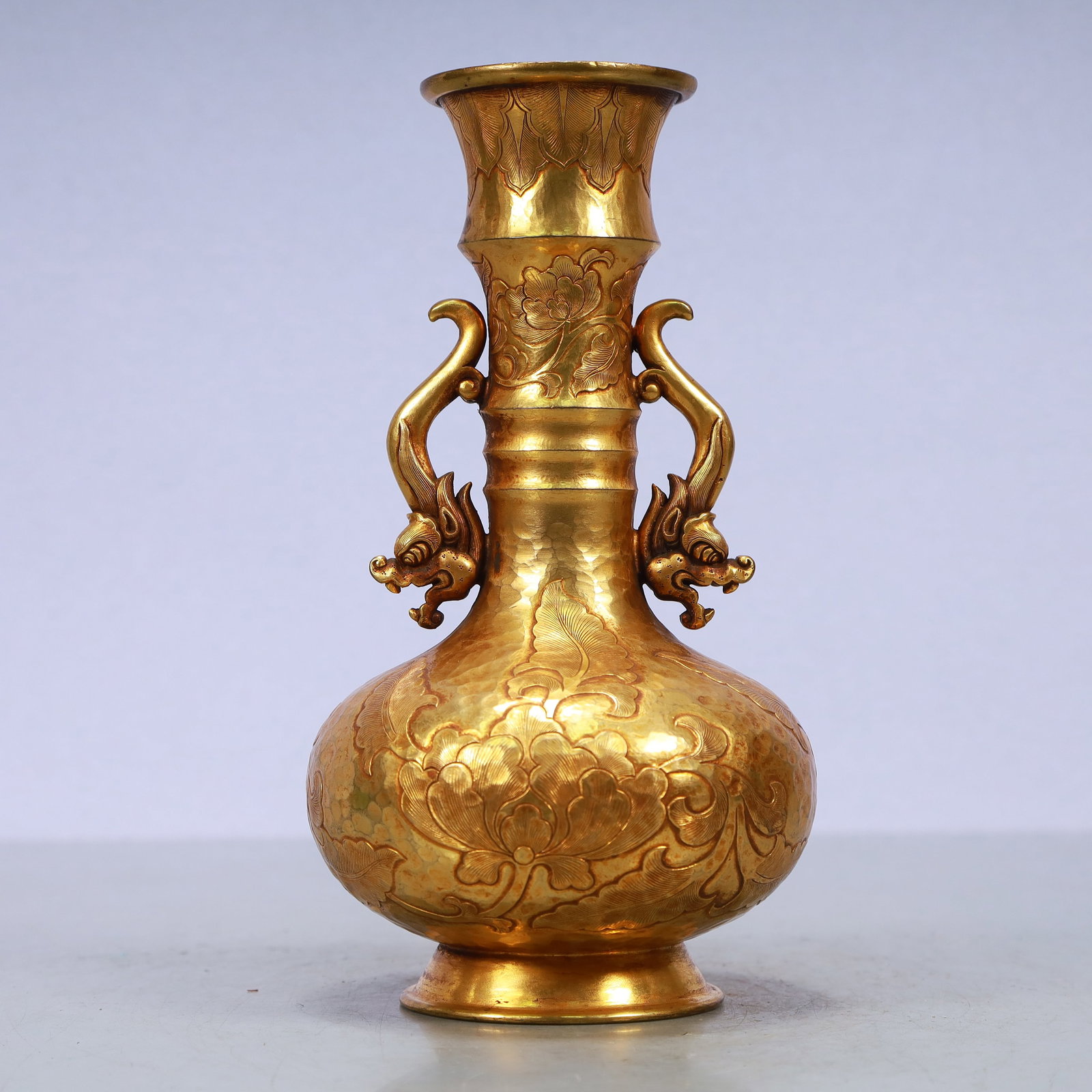 A Exquisite Gilt Bronze Flower Pattern Double-Ears Vase: A Exquisite Gilt Bronze Flower Pattern Double-Ears Vase Qing Dynasty, China Size:4.3inx8.3in Weight:750g铜鎏金花卉纹双耳瓶