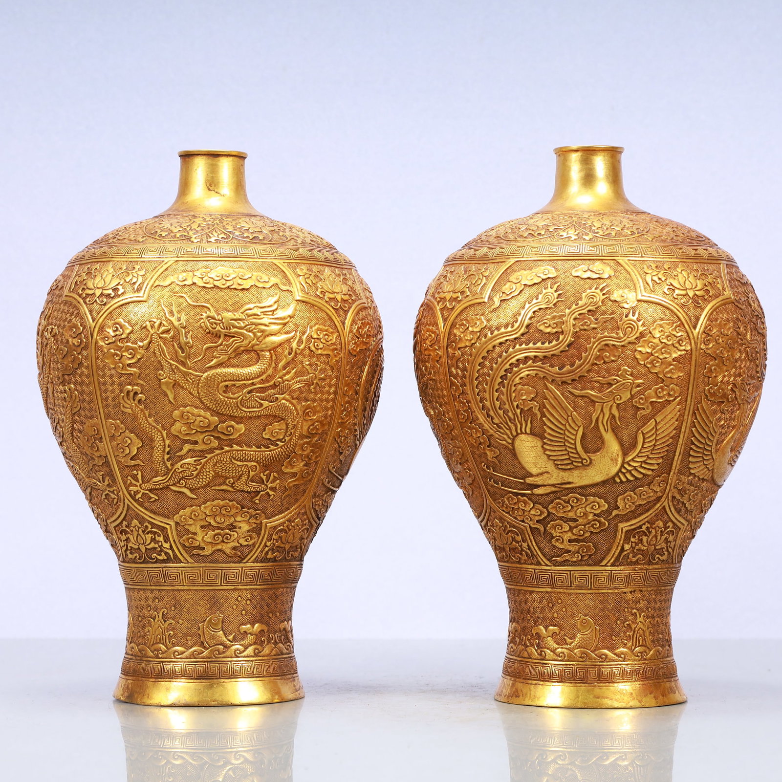 A Exquisite A pair of Gilt Bronze Lotus Pattern Dragon and Phoenix Pattern Vase: A Exquisite A pair of Gilt Bronze Lotus Pattern Dragon and Phoenix Pattern Vase Tang Dynasty, China Zhenguan Four-character Mark Size:6.7inx12.2in