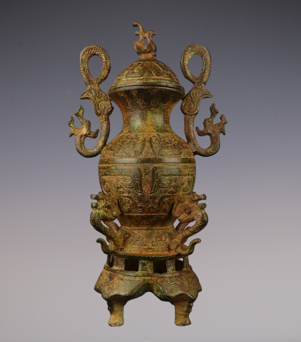 An Archaic Bronze Beast-Face Pattern Dragon-Ears Pot,With Phoenix Cover,With Inscription: An Archaic Bronze Beast-Face Pattern Dragon-Ears Pot,With Phoenix Cover,With Inscription,W.Zhou , China,Size:7.1inx12.6in,Weight:2100g青铜兽面纹龙耳壶,&