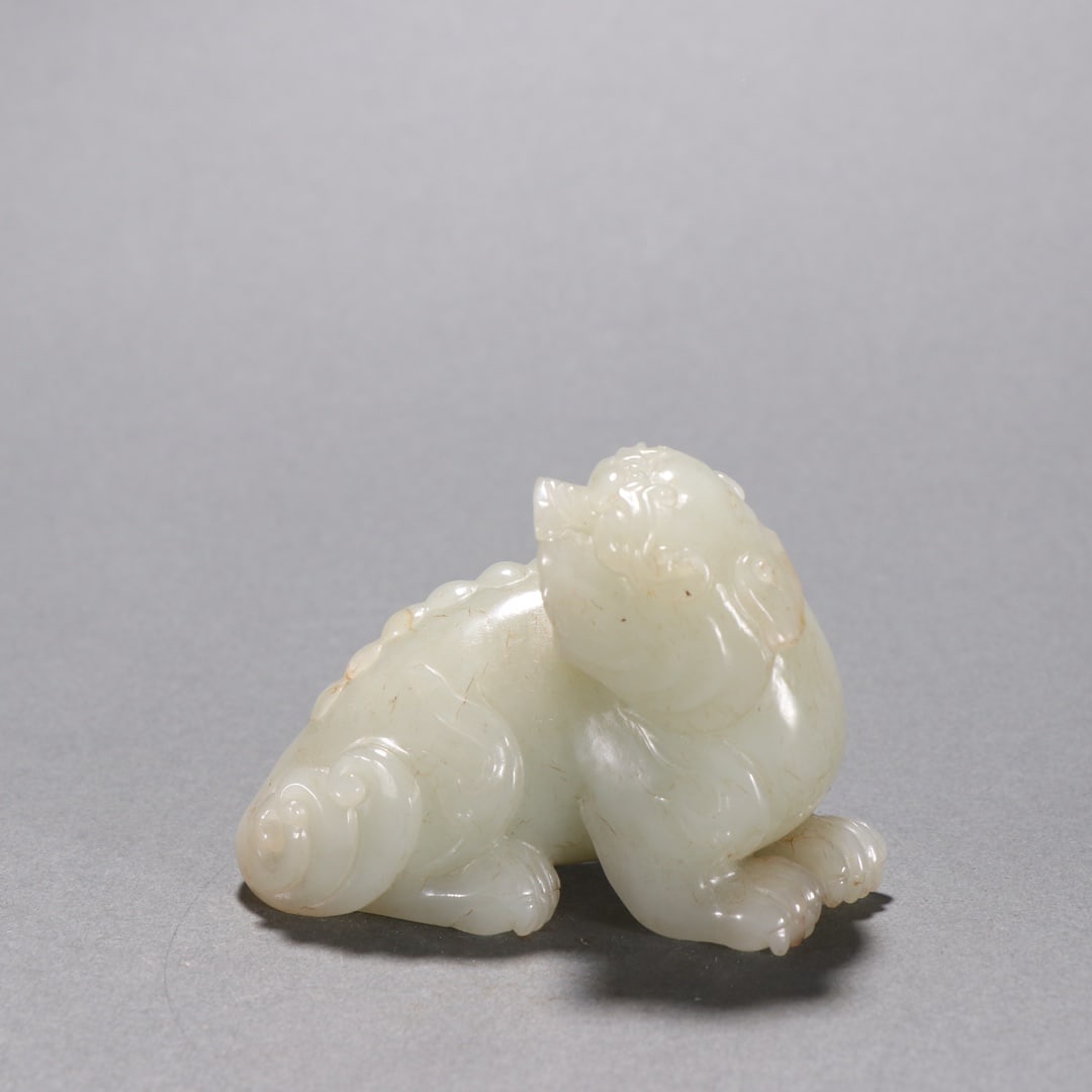 An Exquisite White Jade Auspicious Beast Ornament (1 of 9)