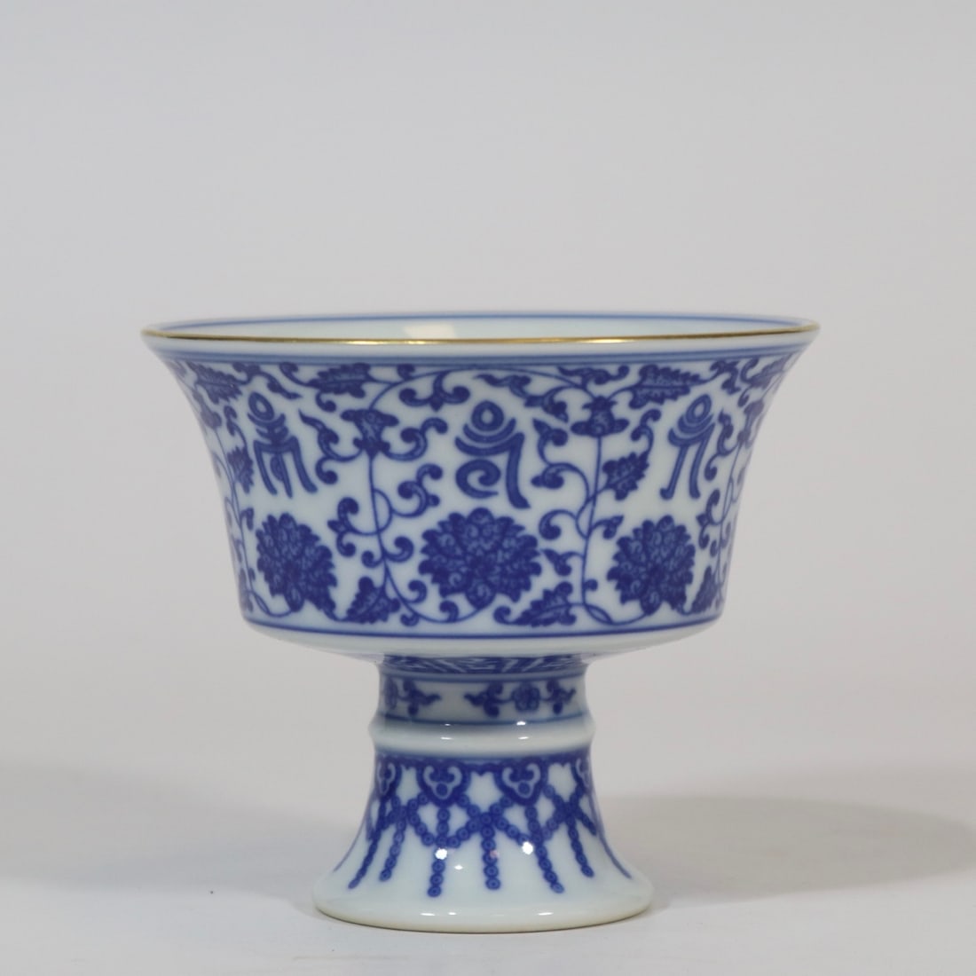 An Exquisite Blue and White Painted Gold Lotus Pattern Stem Cup,With Poem: An Exquisite Blue and White Painted Gold Lotus Pattern Stem Cup,With Poem,Qing Dynasty, China,Yongzheng Six-character Mark,Size:3.1inx3.6in青花描金缠枝莲ń