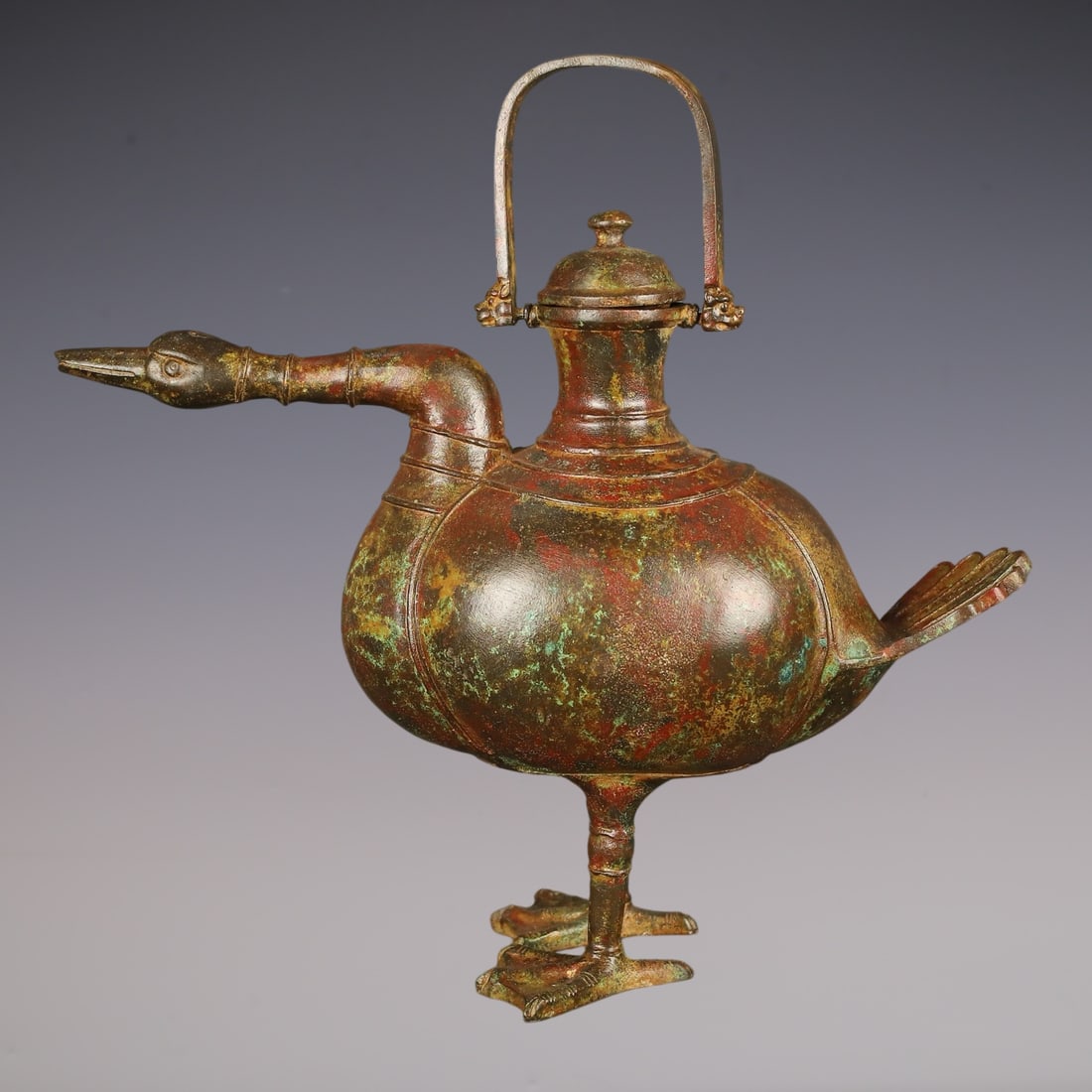 An Archaic Bronze Bird-Shaped Loop-Handled Pot: An Archaic Bronze Bird-Shaped Loop-Handled Pot,Qing Dynasty, China,Qianlong Four-character Mark,Size:14.2inx14.2in,Weight:3000g青铜鸟形提梁壶,中国