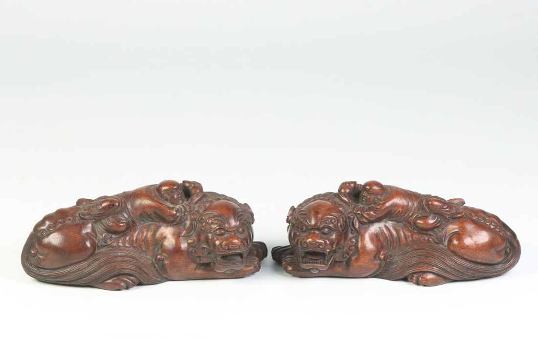 A Pair of Exquisite Eaglewood Figure Pattern Lion Ornaments: A Pair of Exquisite Eaglewood Figure Pattern Lion Ornaments,Qing
