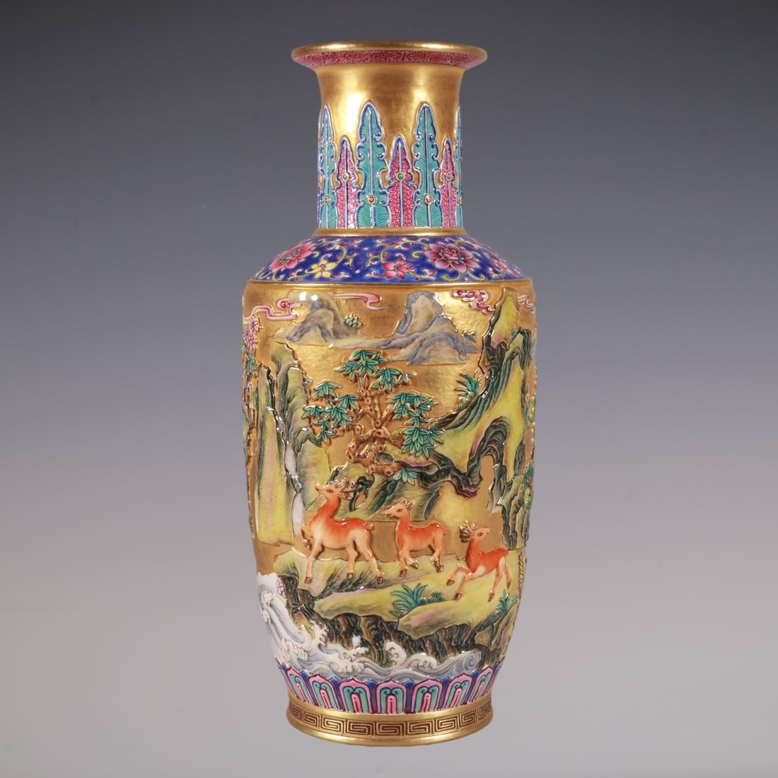 An Exquisite Enamel Gold Ground Pine and Deer Pattern Vase: An Exquisite Enamel Gold Ground Pine and Deer Pattern Vase,Qing Dynasty, China,Qianlong Six-character Mark,Size:9.1inx3.9in珐琅彩金地松鹿纹瓶,