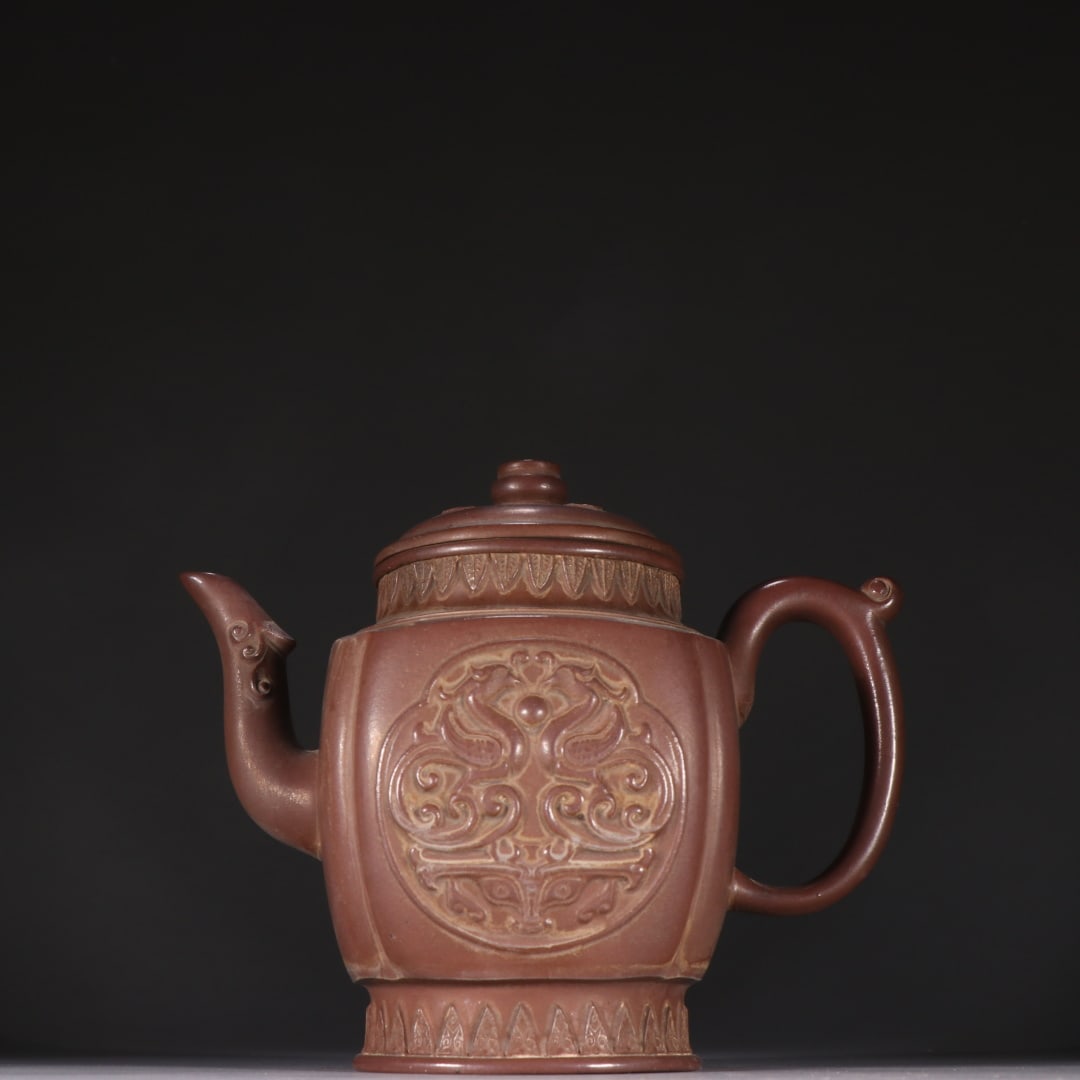 An Exquisite Purple Sands Phoenix Pattern Teapot: An Exquisite Purple Sands Phoenix Pattern Teapot,Qing Dynasty,China,With Mark,Size:5.9inx7.1in紫砂凤纹茶壶,中国清代,带款,Size:15