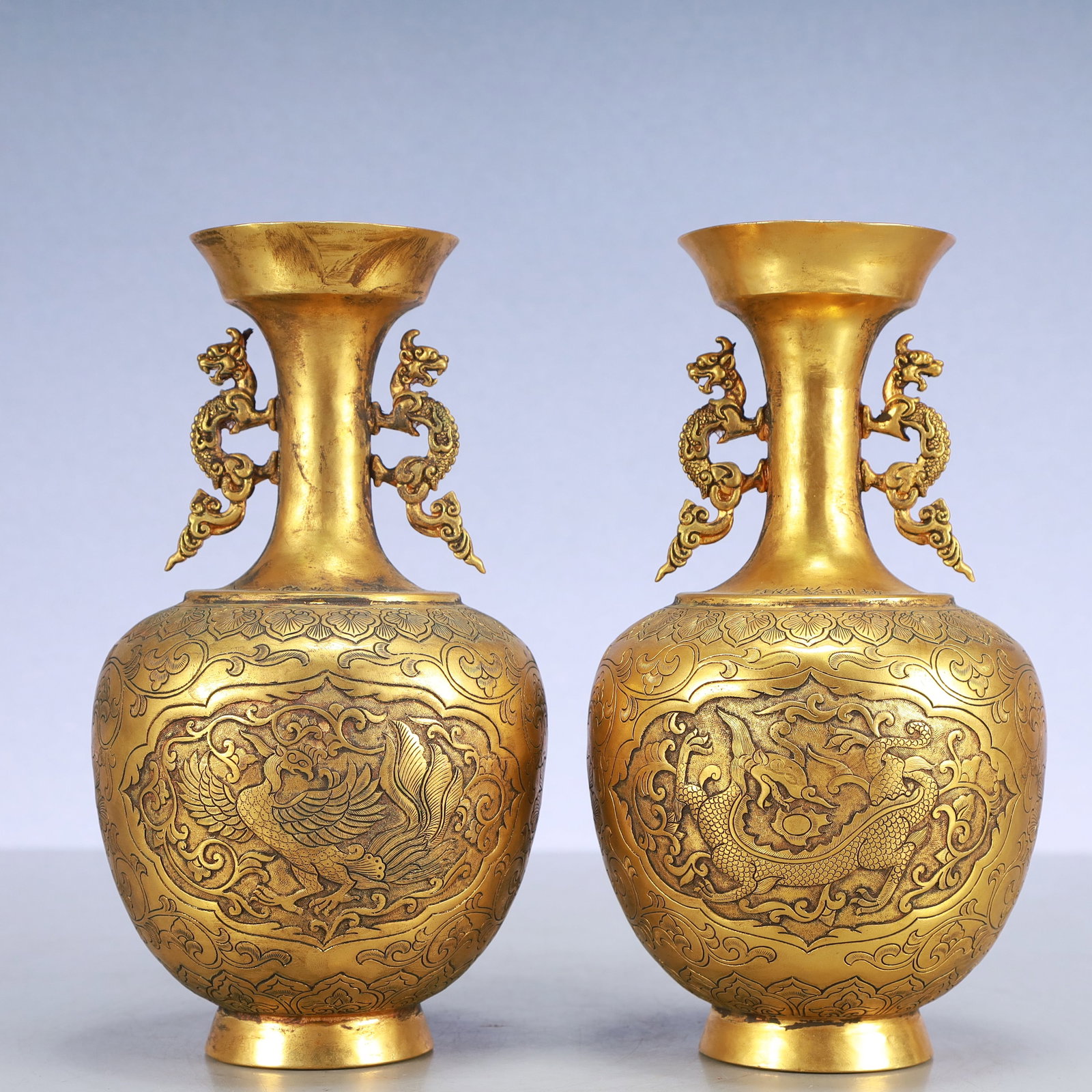 A Exquisite A pair of Gilt Bronze Lotus Pattern Dragon and Phoenix Pattern Double-Ears Vase: A Exquisite A pair of Gilt Bronze Lotus Pattern Dragon and Phoenix Pattern Double-Ears Vase Qing Dynasty, China Size:4.7inx8.3in