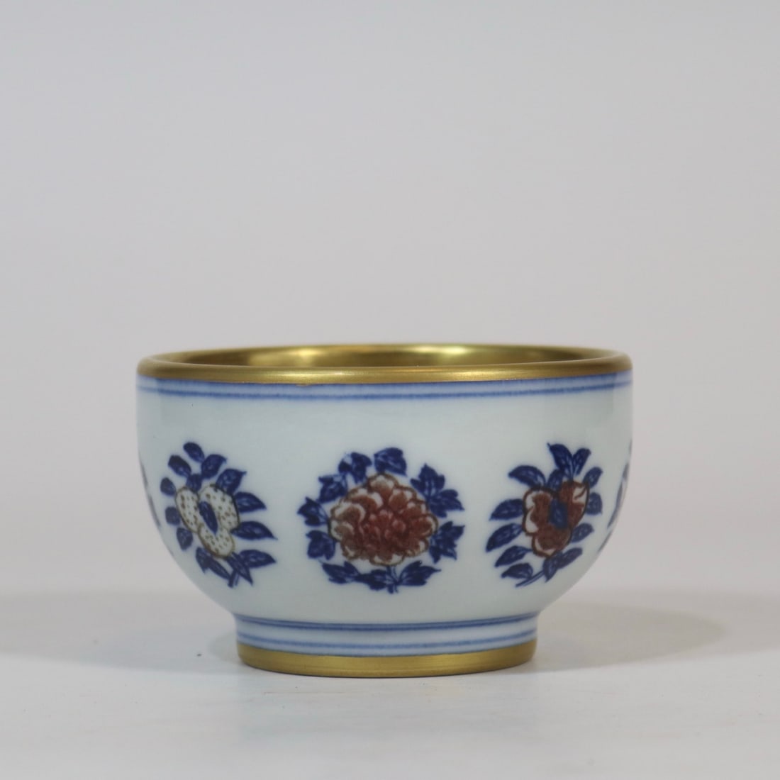 An Exquisite Blue and White Underglaze-Red Painted Gold Flower and Fruit Pattern Cup: An Exquisite Blue and White Underglaze-Red Painted Gold Flower and Fruit Pattern Cup,Qing Dynasty, China,Qianlong Four-character Mark,Size:2inx3.3in青花釉里红描%