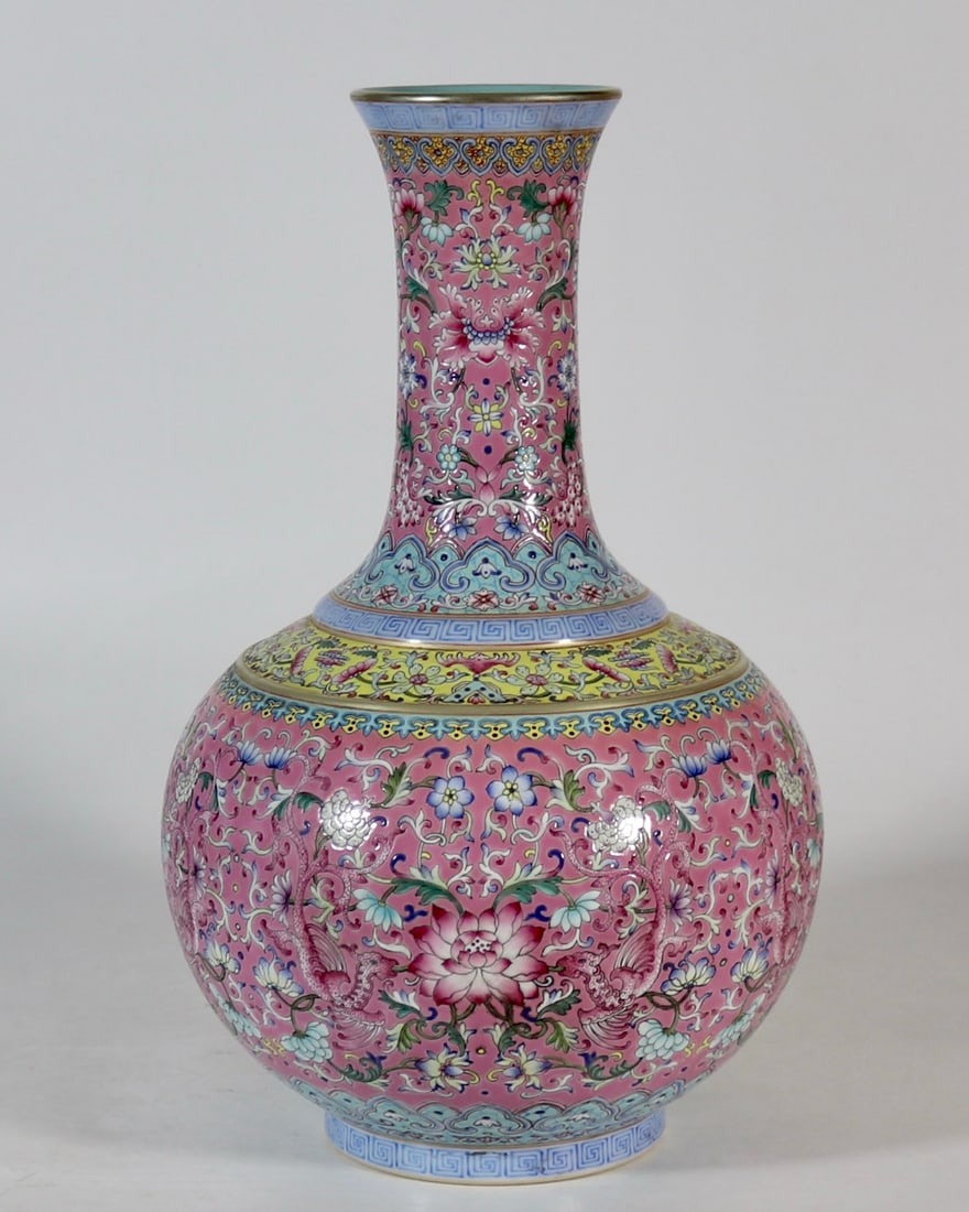 A Rare Enamel Pink Ground Painted Gold Lotus and Phoenix Pattern Vase: A Rare Enamel Pink Ground Painted Gold Lotus and Phoenix Pattern Vase,Qing Dynasty, China,Qianlong Four-character Mark,Size:15.6inx3.9in珐琅彩粉地描金缠