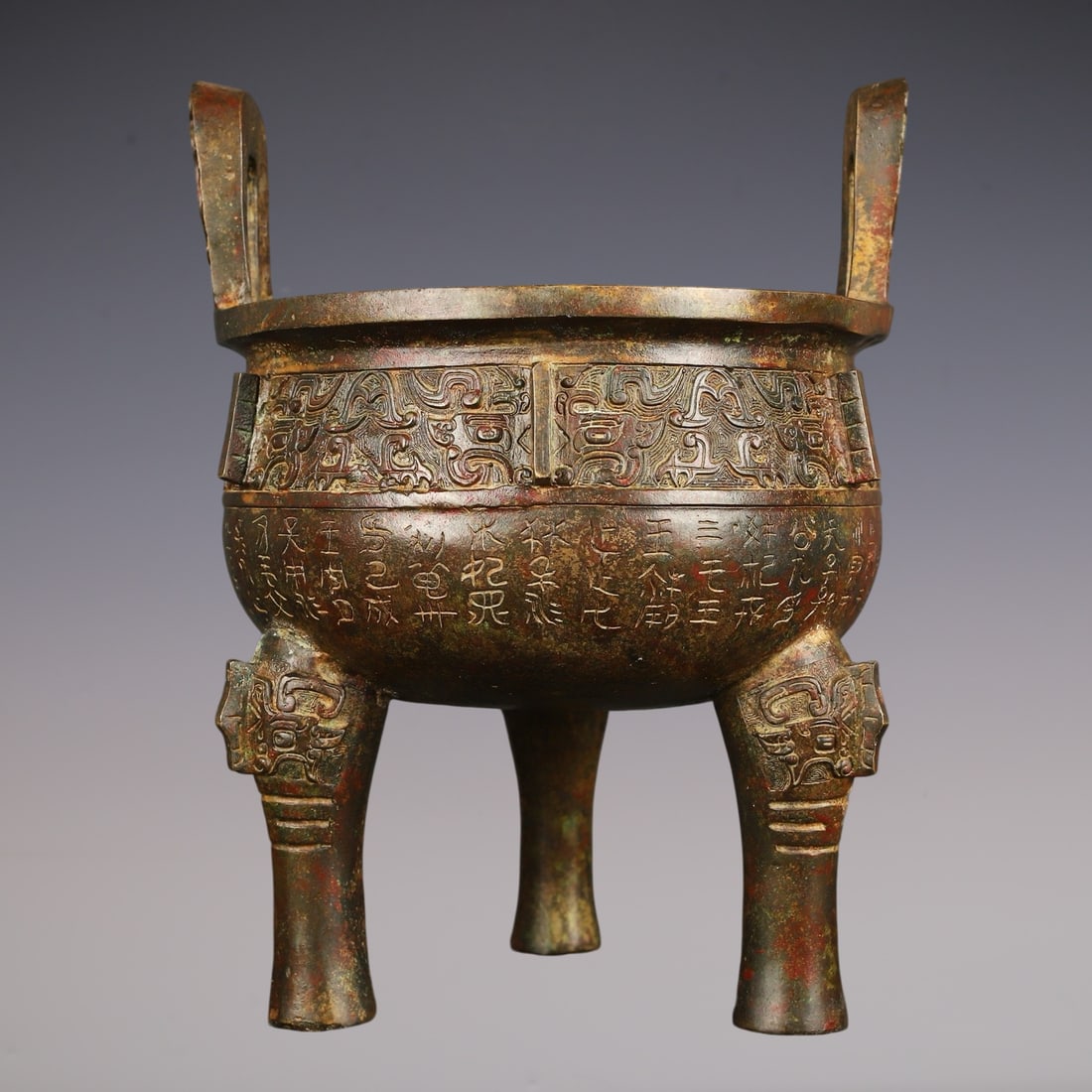 An Archaic Bronze Beast-Face Pattern Double-Ears and Tripod Censer,With Inscription: An Archaic Bronze Beast-Face Pattern Double-Ears and Tripod Censer,With Inscription,W.Zhou ,