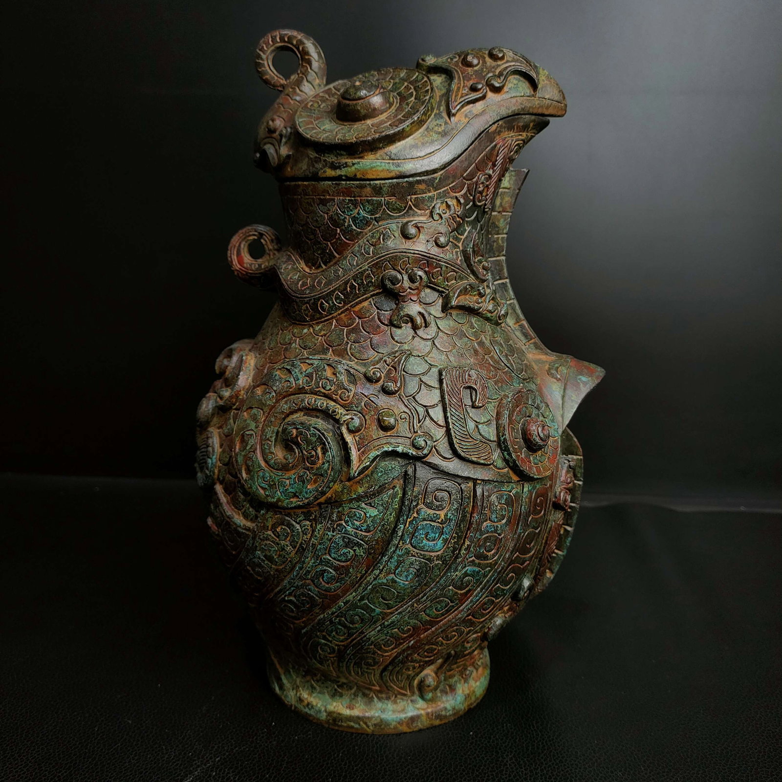 An Archaic Bronze Dragon Pattern Bird-Shaped Pot: An Archaic Bronze Dragon Pattern Bird-Shaped Pot,Qing Dynasty, China,Size:10.6inx6.7in,Weight:2800g青铜龙纹鸟形壶,中国清代,Size:27cmx1
