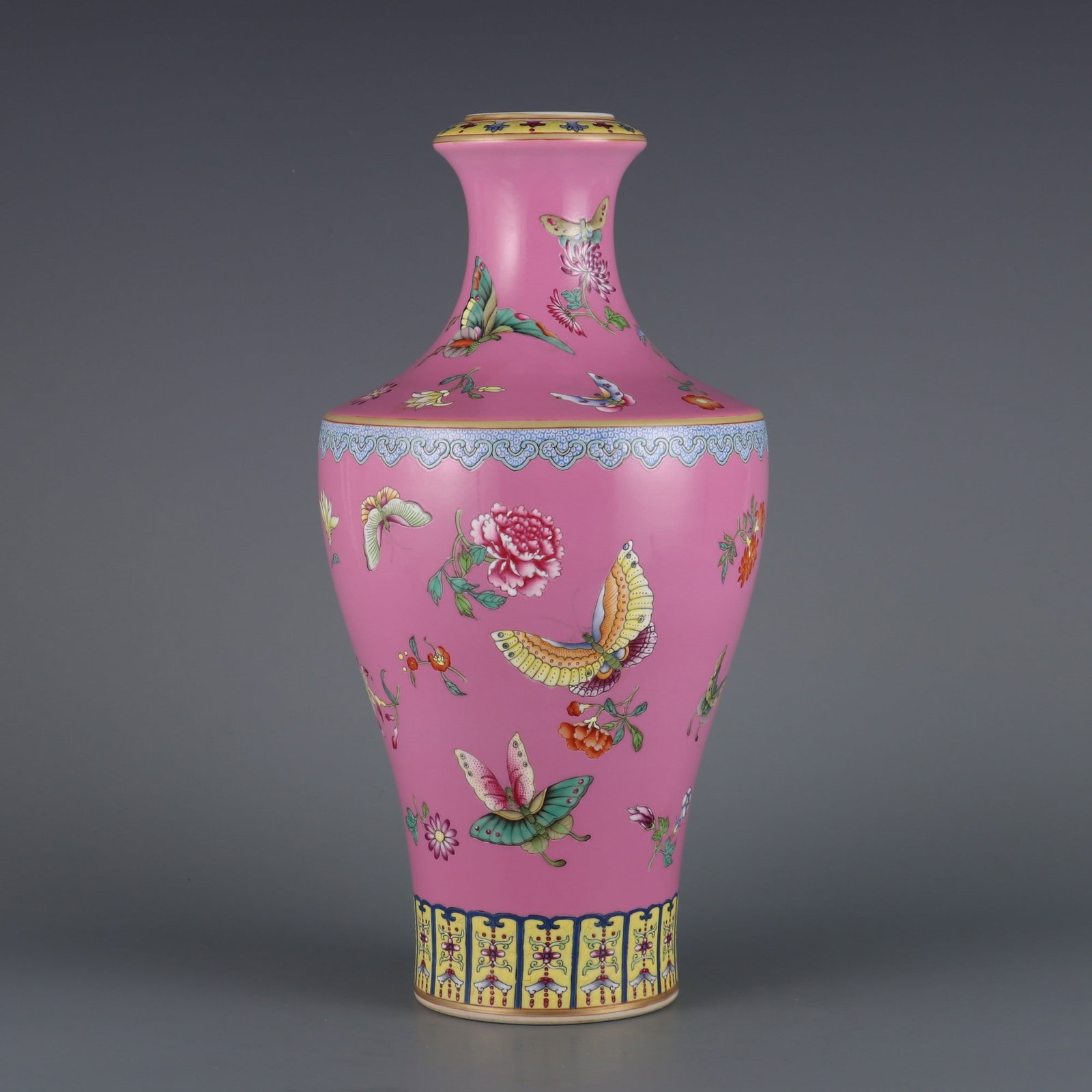 A Rare Pink Ground Enamel Painted Gold Flower and Butterfly Pattern Vase: A Rare Pink Ground Enamel Painted Gold Flower and Butterfly Pattern Vase,Qing Dynasty, China,Qianlong Six-character Mark,Size:12.8inx2in粉地珐琅彩描金花