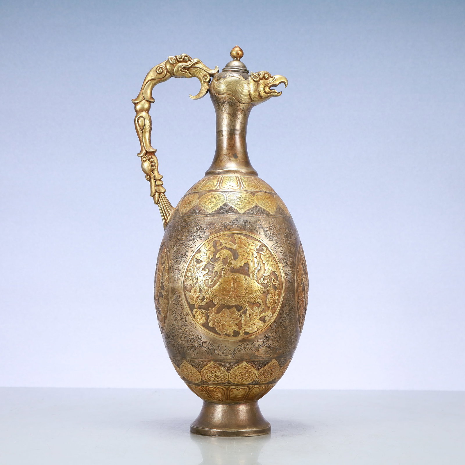 A Exquisite Gilt Silver Flower Pattern Auspicious Beast Pattern Ewer: A Exquisite Gilt Silver Flower Pattern Auspicious Beast Pattern Ewer Tang Dynasty, China Size:6.7inx5.5inx15.7in