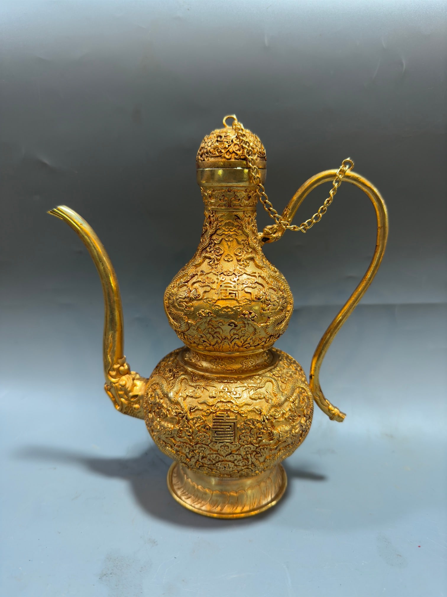 An Exquisite Gilt Bronze Auspicious Cloud and Dragon Pattern Gourd-Shaped Flagon: An Exquisite Gilt Bronze Auspicious Cloud and Dragon Pattern Gourd-Shaped Flagon,Tang Dynasty,China,Zhenguan Four-character