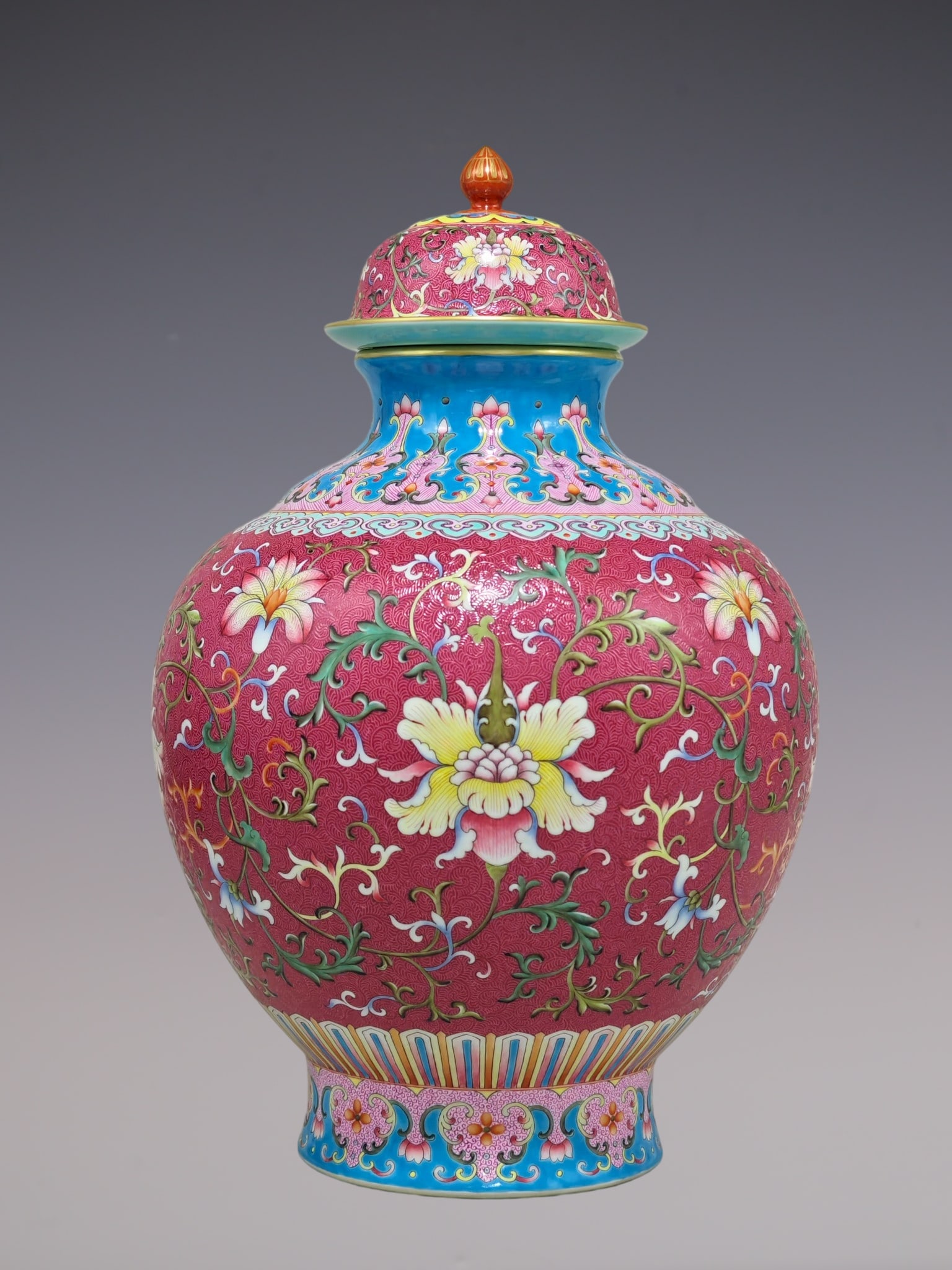 A Rare Enamel Ruby Red-Glazed Lotus Pattern Jar with Cover: A Rare Enamel Ruby Red-Glazed Lotus Pattern Jar with Cover,Qing Dynasty, China,Qianlong Four-character Mark,Size:15inx9.8in珐琅彩胭脂红釉缠枝ő