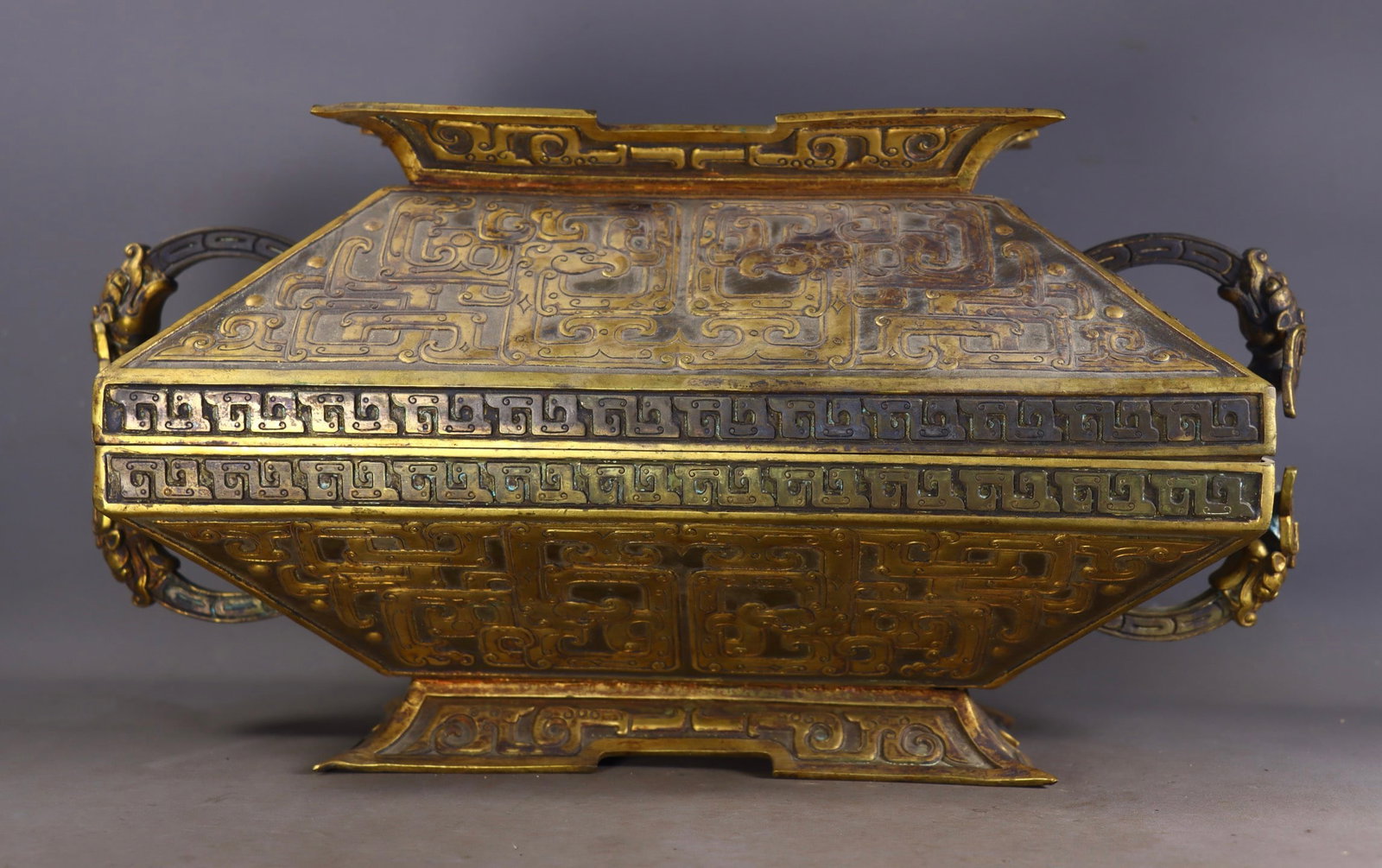 A Rare Gilt Bronze Beast-Face Pattern Double-Ears Box with Cover: A Rare Gilt Bronze Beast-Face Pattern Double-Ears Box with Cover,Qing Dynasty,China,Size:8.7inx15inx9.3in,Weight:6170g铜鎏金兽面纹双耳盖盒&#