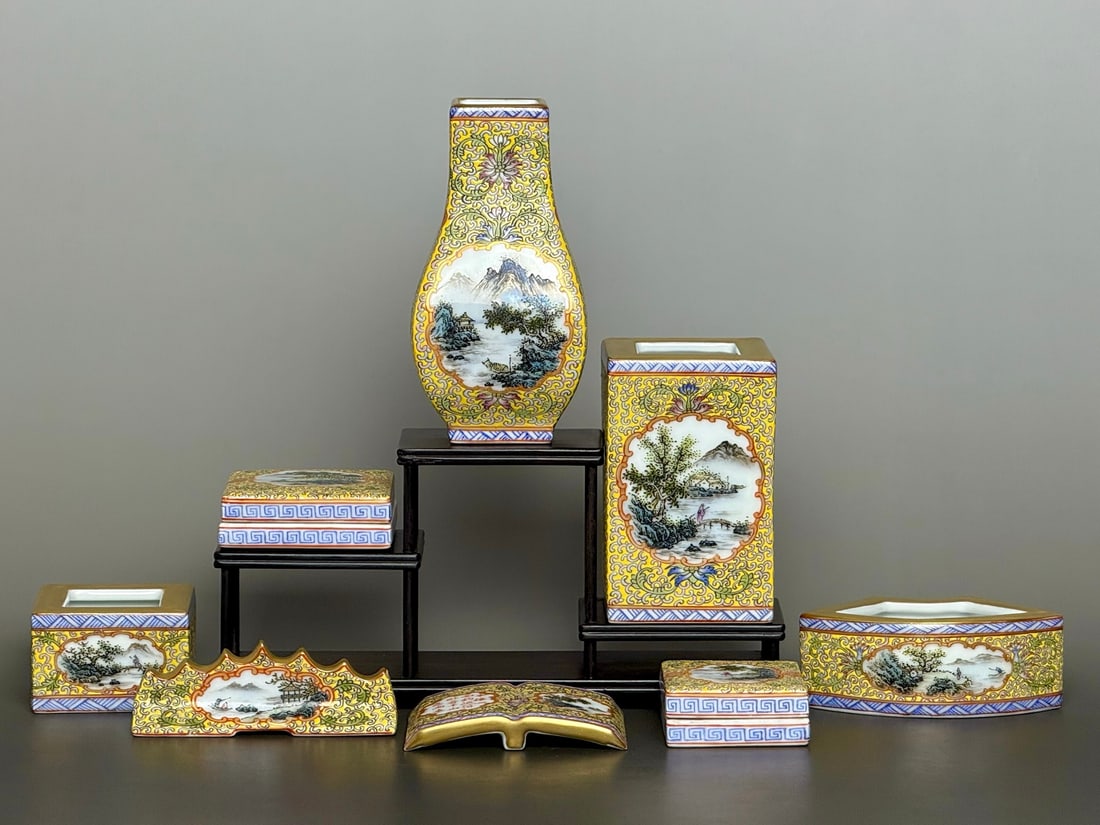 A Set of Fine Yellow Ground Famille-Rose Painted Gold Landscape and Figure Pattern Ornaments,With: A Set of Fine Yellow Ground Famille-Rose Painted Gold Landscape and Figure Pattern Ornaments,With Poem,Qing Dynasty,China,Qianlong Six-character Mark,Size:(Vase)5.4inx2.8inx1.7in,(Brush Pot)2.6inx4.2i