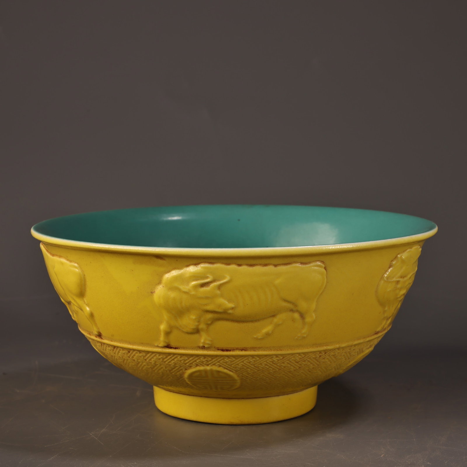 An Exquisite Enamel Yellow Ground Painted Gold Eight Treasures and Buffalo Pattern Bowl: An Exquisite Enamel Yellow Ground Painted Gold Eight Treasures and Buffalo Pattern Bowl,Qing Dynasty,China,Yongzheng Four-character Mark,Size:2.8in,Weight:400g珐琅彩黄地&