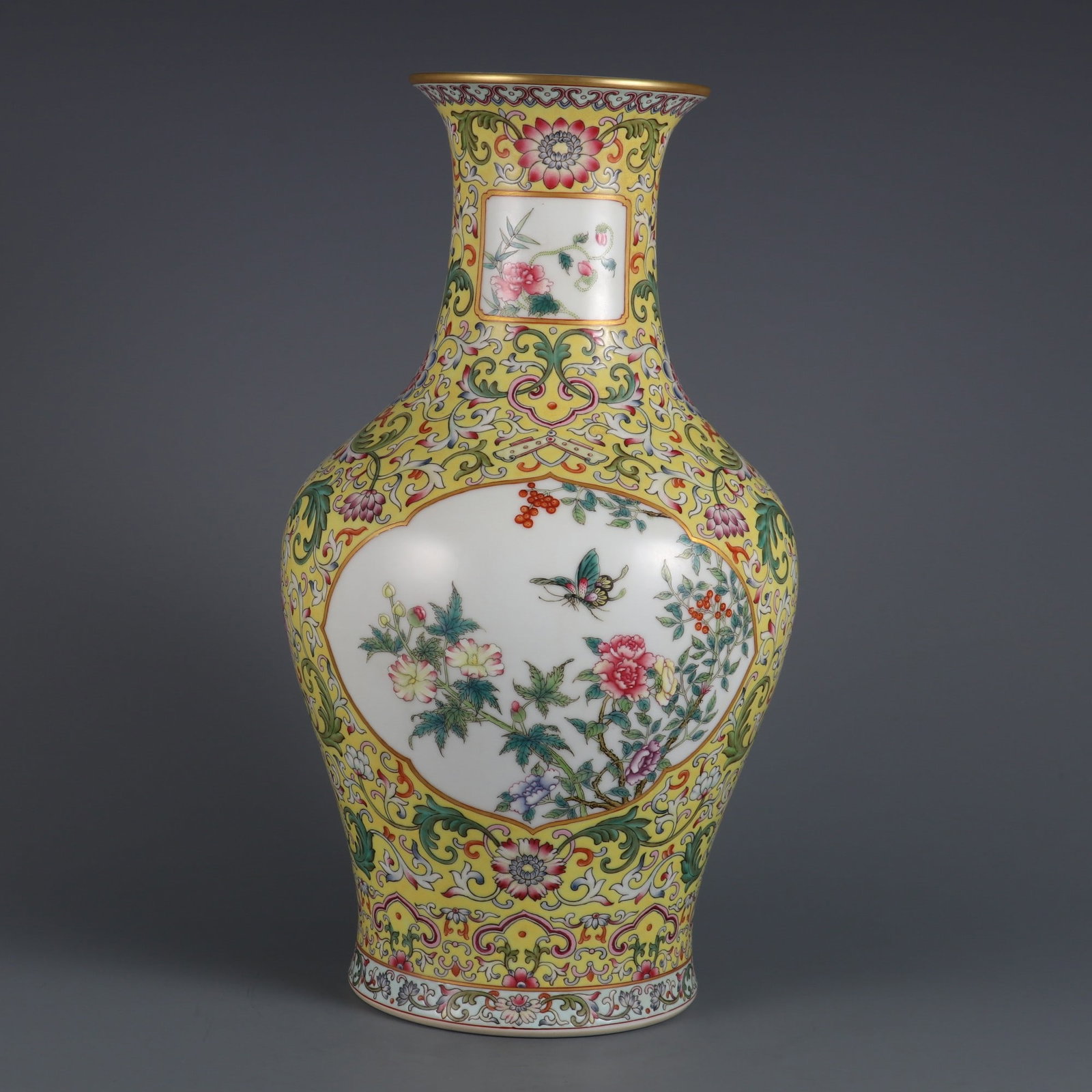 A Rare Yellow Ground Famille-Rose Painted Gold Flower Pattern Vase: A Rare Yellow Ground Famille-Rose Painted Gold Flower Pattern Vase,Qing Dynasty, China,Qianlong Six-character Mark,Size:13.1inx4.1in黄地粉彩描金花卉 