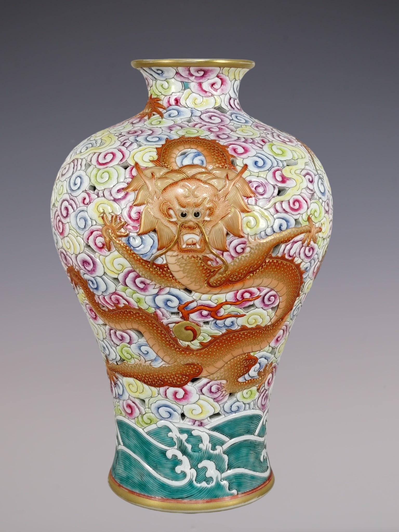 A Rare Famille-Rose Painted Gold Hollow Seawater,Auspicious Cloud and Dragon Pattern Vase: A Rare Famille-Rose Painted Gold Hollow Seawater,Auspicious Cloud and Dragon Pattern Vase,Qing Dynasty, China,Qianlong Six-character Mark,Size:12.2inx7.9in粉彩描金镂Ĺ