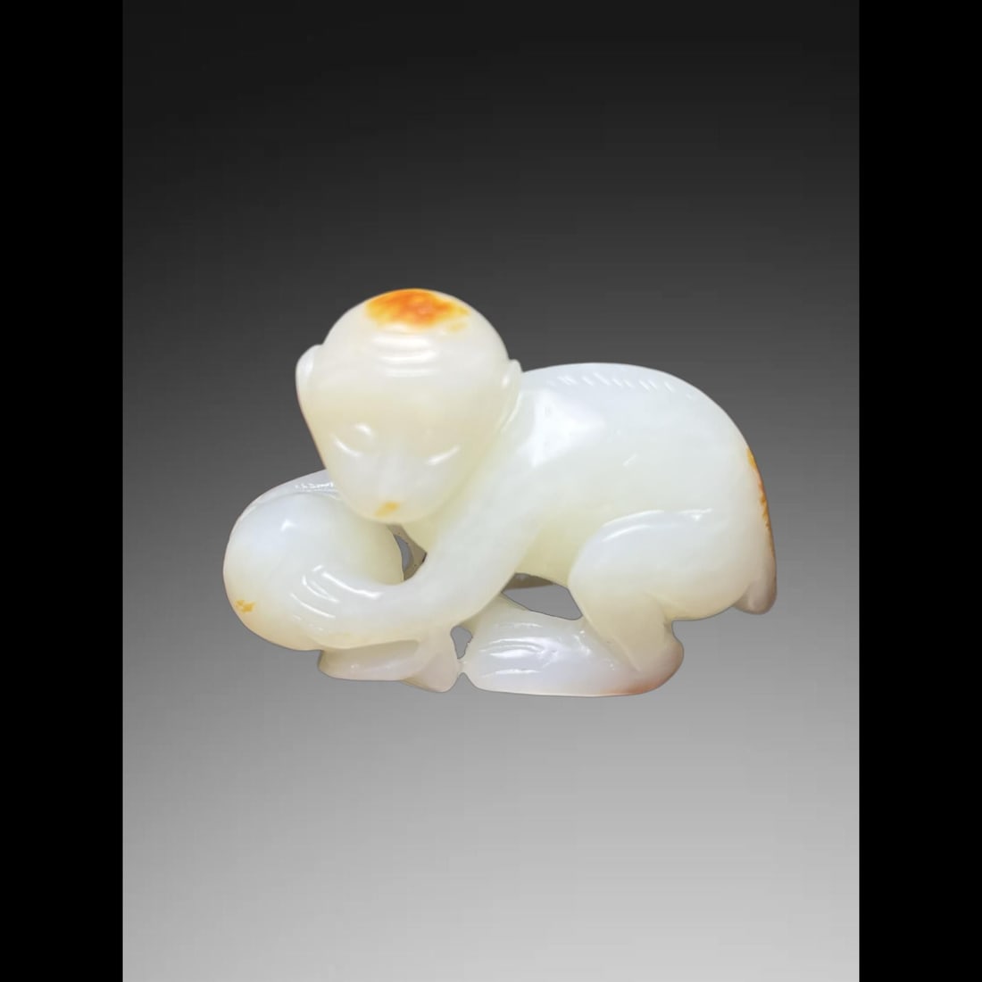 An Exquisite Hotan Jade Monkey Handheld Carving: An Exquisite Hotan Jade Monkey Handheld Carving,Qing Dynasty, China,Size:2.1inx0.9inx1.5in,Weight:53g 和田玉猴手把件,中国清代