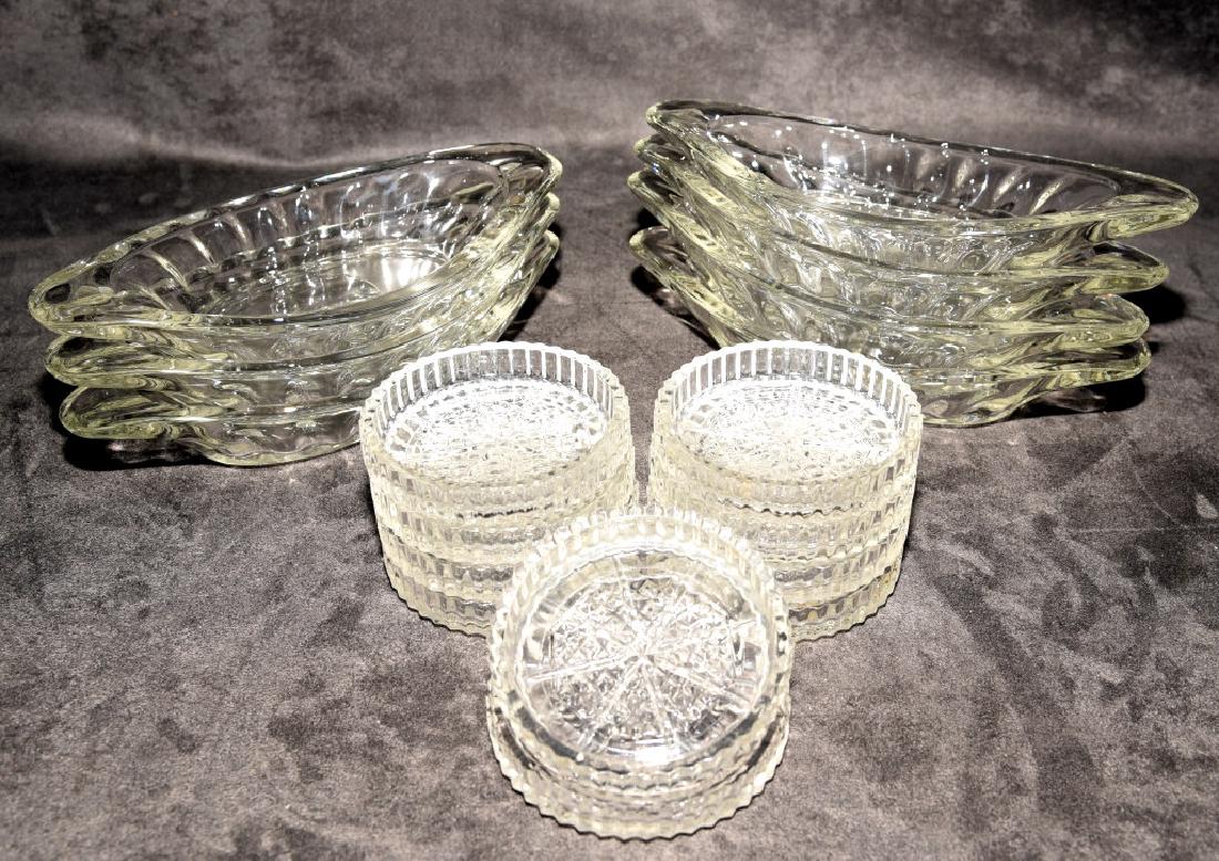 Heavy Glass Ice Cream Dishes & Pressed Coasters: Seven 9" long ice cream dishes and 10 pressed glass coasters.