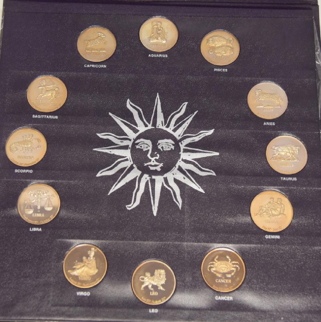 Danbury Mint Beckton Zodiac Collection in Sheath: Coins w/symbols and dates, verso with traits, best day, lucky colour and lucky number, Registered Limited Proof Edition.