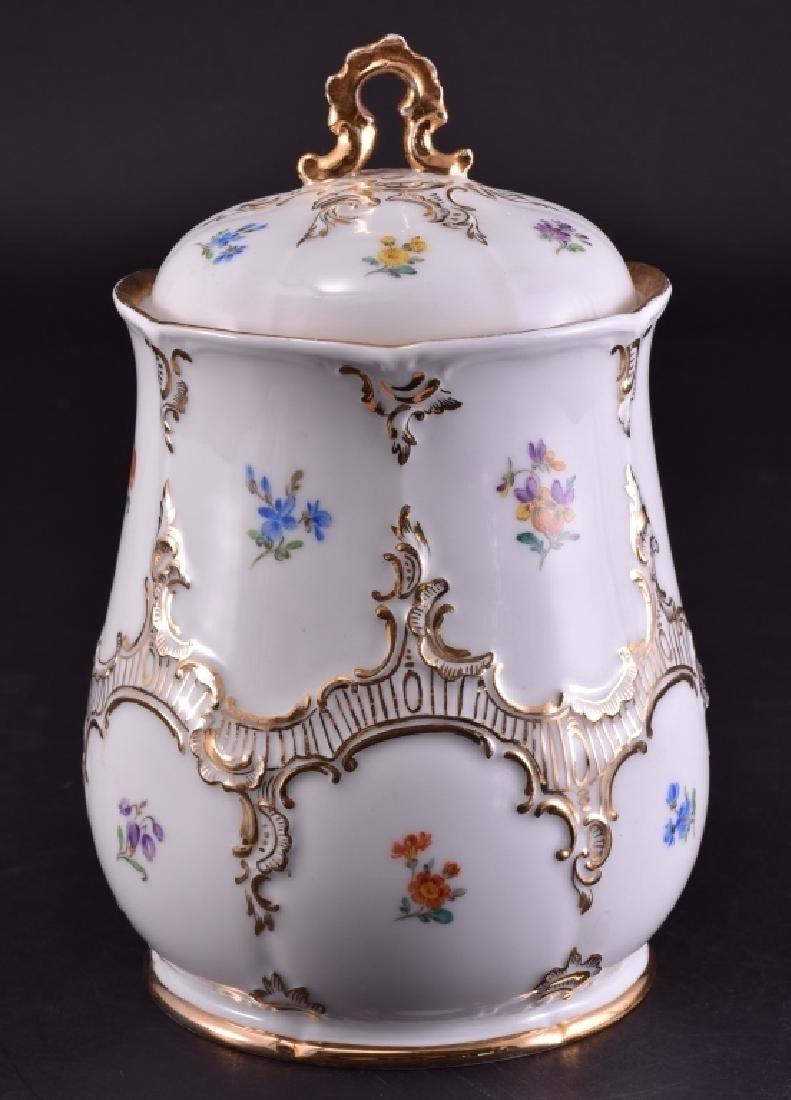 White Porcelain Covered Jar w/Flowers & Gold Trim: W/crossed swords mark, 9" high.