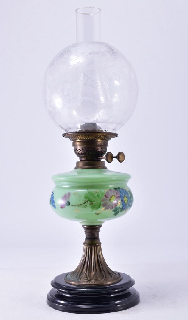 Antique British Made Oil Lamp: Etched ball shade and flattened handpainted green shade, marked on wick controls and bottom, 23" tall.