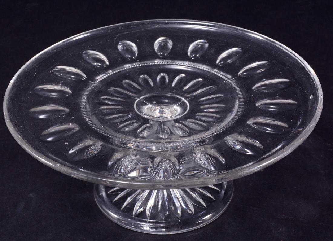EAPG Possibly Punty Band Low Cake Stand: Almond thumbprints w/plain band & rayed foot, A.H. Heisey & Co., 8.75" diameter x 3.5" high.