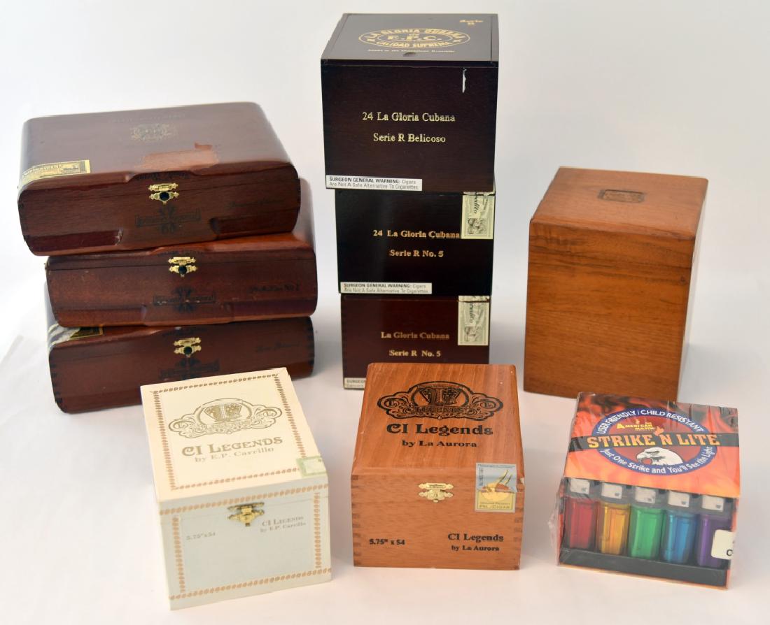 Collectible Cigar Boxes Plus: 3 Opus X wooden boxes (1 lid w/finish damage), 3 La Gloria Cubana Boxes, 2 Legends, glass pipe rest & tobacco pouch and 50 lighters mint in package.