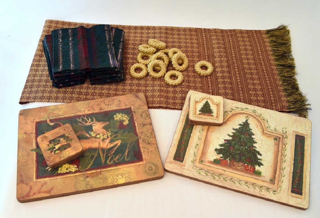 Pimpernel Place Mats & Coasters, Napkins Plus: 4 Reindeer place mats & 6 coasters, 4 Christmas tree place mats & 6 coasters, 12 napkins, 11 gold rope napkin rings and a table runner.
