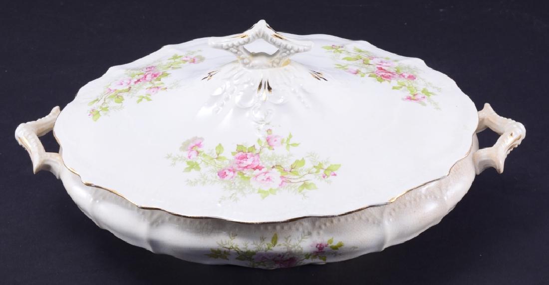Vintage Oval Covered Pedestal Casserole w/Roses: Fluted lid w/pierced finial and shaped edge, double handles match finial, crackled, 11.5" handle to handle. Ceramic loss on bottom.