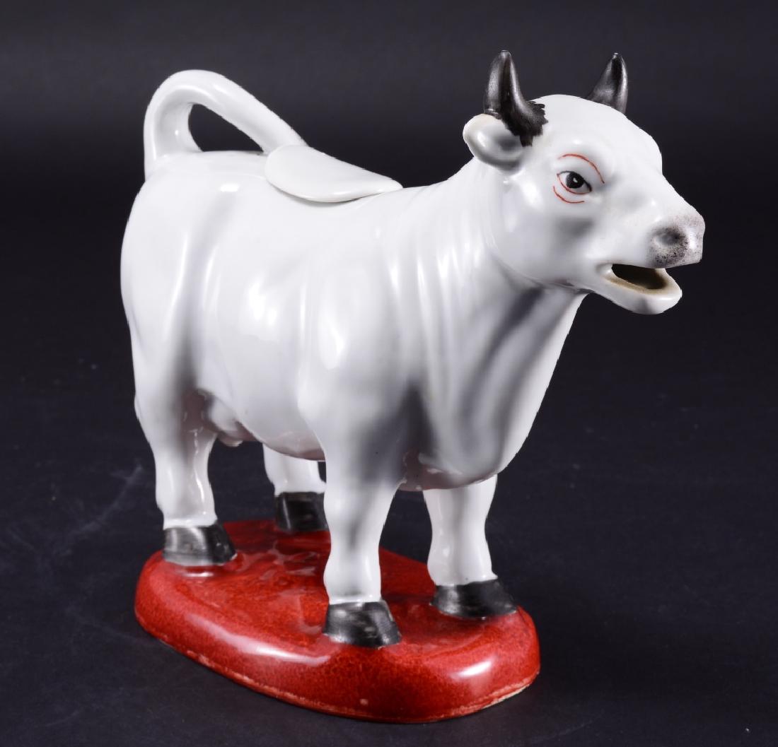 White Cow Creamer w/Lid & Red Base: Maitland-Smith LTD marked on bottom , 7 3/4" tall x 9" long.
