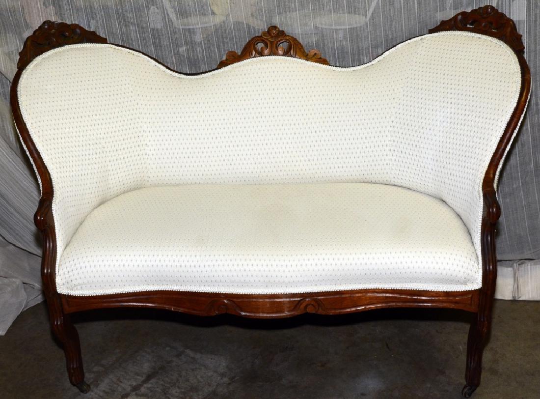 Walnut Victorian Settee: Cream color upholstery, 33" high x 46" wide x 24" deep x 33" high.