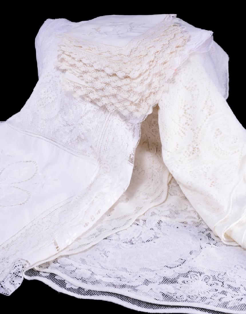 Lace Tablecloths & Napkins: Embroidered & lace tablecloth 116" long x 66" wide; Oval lace tablecloth 76" long x 58" wide; Oval lace tablecloth 84" long x 60" wide AND 11 embroidered & lace napkins.