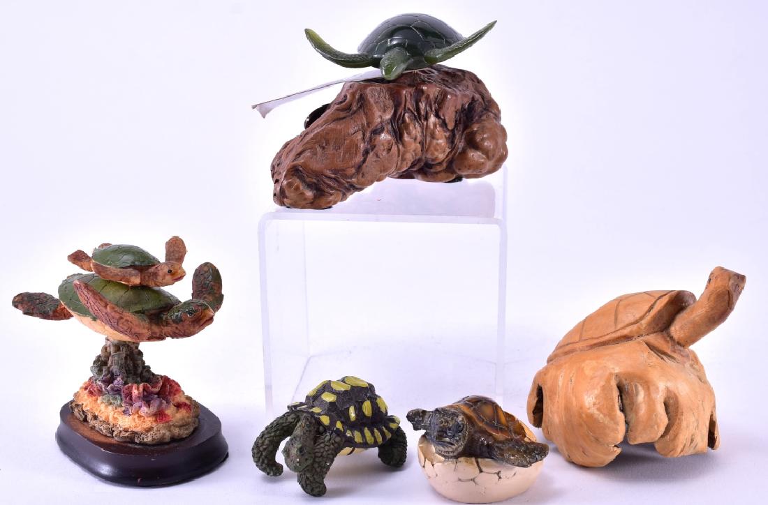 Five Mixed Media Turtle Figurines: Inc: John Perry 3" high turtle made from " Pellucida;" composite mother & baby turtle, 3.25" high; natural carved turtle,3.25" high; composite turtle ideal to hang on pot edge, 2.5" long and ceramic &