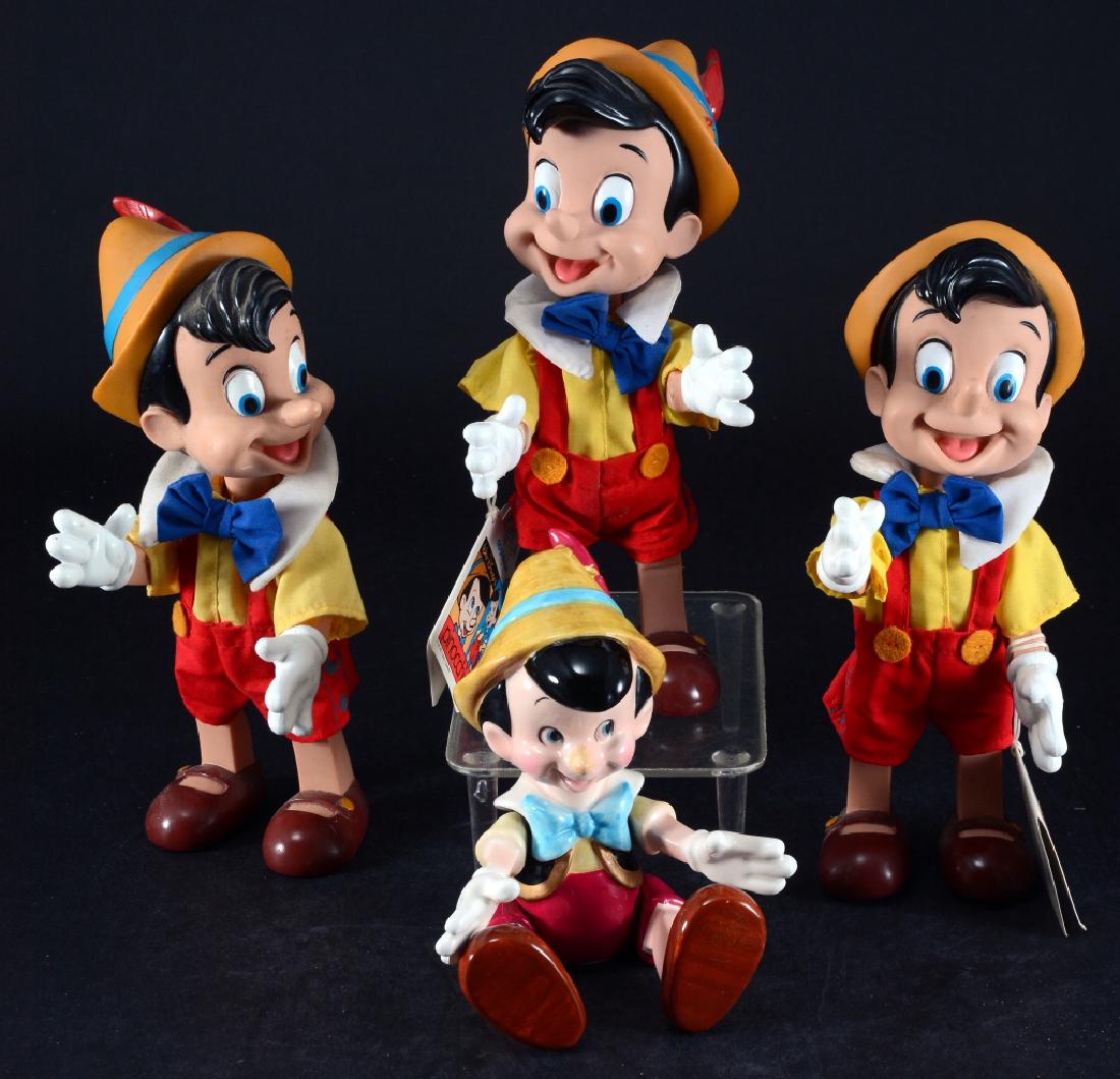 4 Jointed Pinocchio Figures, 1 a Music Box: One ceramic 8" tall is Schmid music box & plays "The Entertainer" and three plastic & vinyl, 9.25" tall, all articulated.