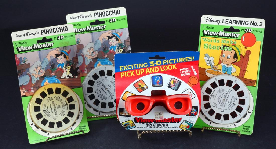 View-Master & 3 Packages Pinocchio Reels: View-Master in original sheath w/demo reel and 3 packages of 3 reels each.