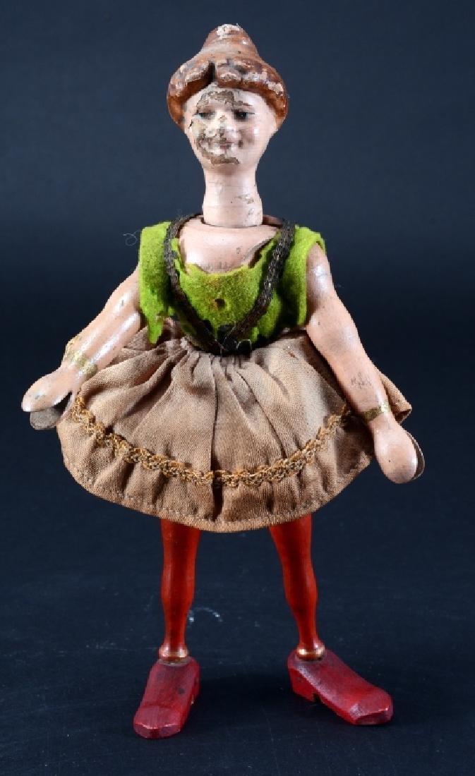 Schoenhut Acrobat: Eyes: painted blue. Body: painted wood. Hair: molded, painted. Head: wood. Clothing: skirt & top. 8.5" tall. G.