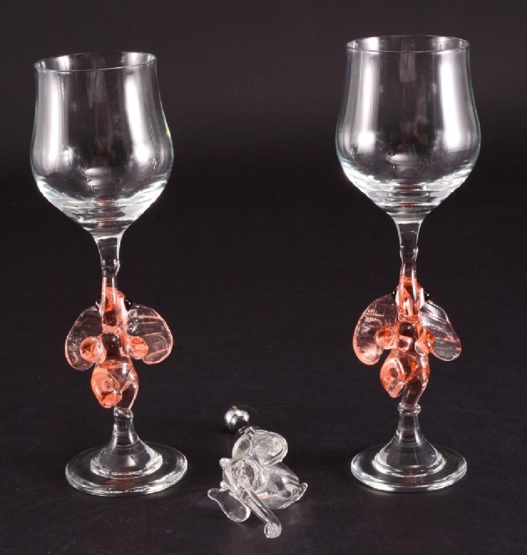 Pair Elephant Stem Wine Glasses & Bottle Stopper: Hand blown glass. Pink elephant stem glasses 7.75" tall & elephant wine bottle stopper, 6 1/8" long.