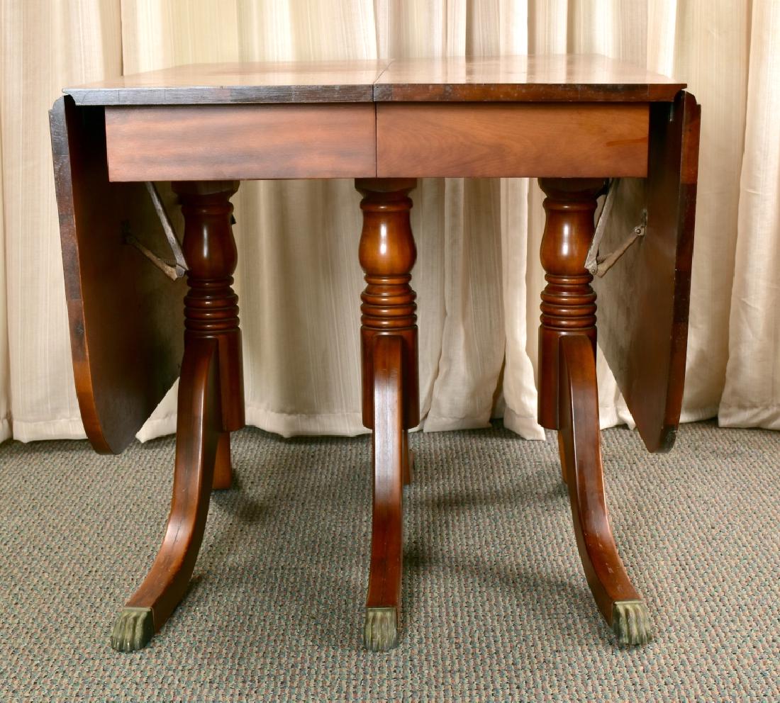 Federal Style Dining Table: Three center legs, 29 5/8" tall x 65.5" wide x 42" deep 7 3 leaves each 10" wide, pads for basic table.