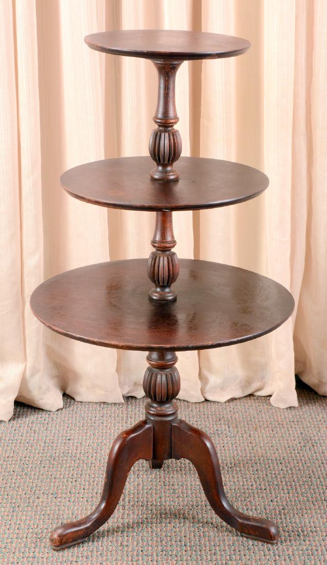 3-Tiered Dumb Waiter: 3 graduated trays, 3 outswept legs, snake feet. 41" high.