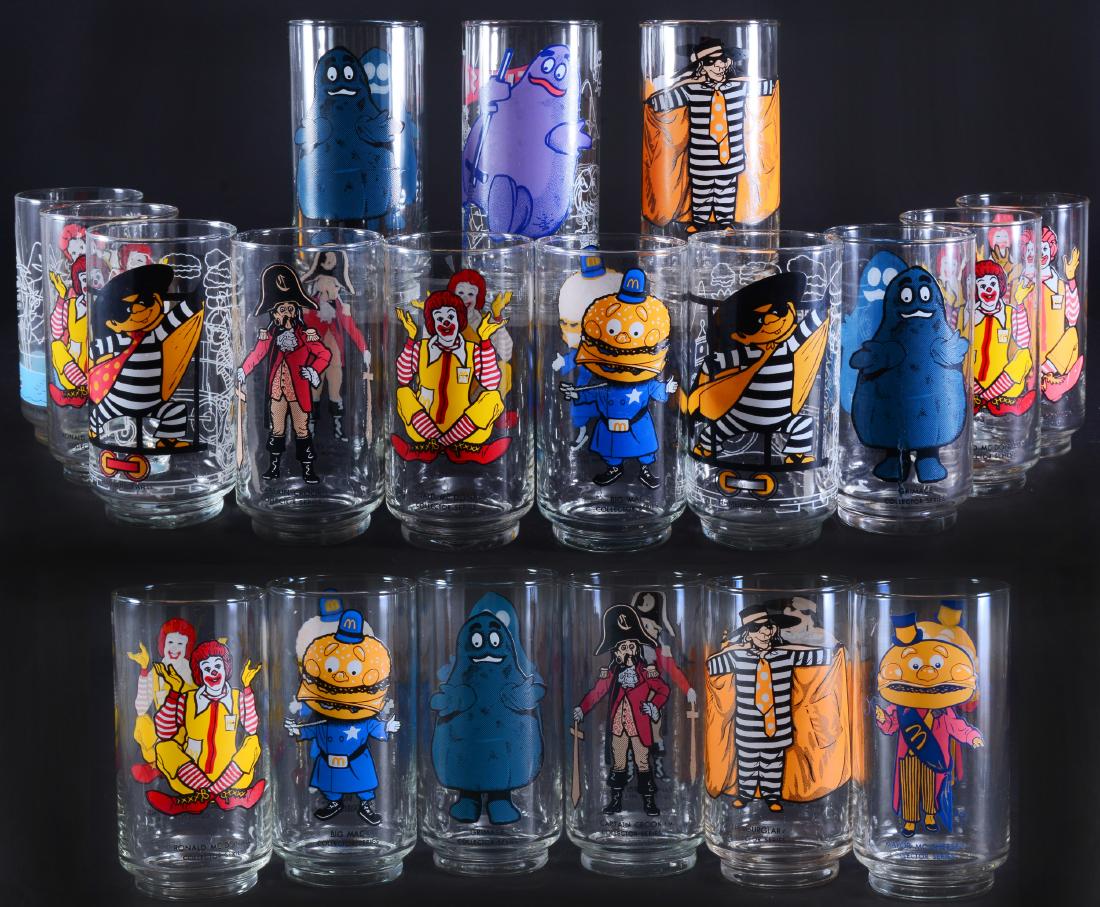 19 Ronald McDonald Collector Series Glasses: Inc. Big Mac, Captain Crook, Hamburglar, Grimace & Ronald McDonald 5.25" tall.