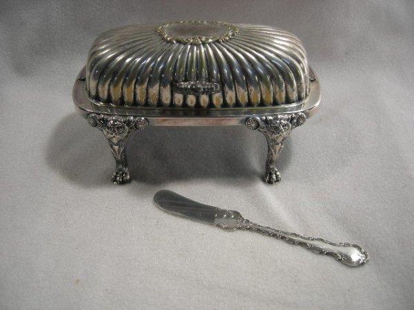 STERLING BUTTER KNIFE & PLATED BUTTER DISH: Gorham Sterling Master Butter Knife & F.B. Rogers Co. Covered Butter Dish w/Rotating Lid & 4 Legs w/Lion Heads Ending in Paw Feet. Butter Dish 6.5"L X 4.25"T, Knife 6"L.