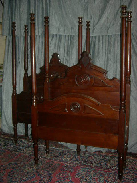 PAIR ANTIQUE TWIN 4 POSTER BEDS: Pair Antique Twin 4 Poster Beds w/Turned Legs, Wooden Casters, Round Wooden Medallions, Posters 68.25"T, Head Board 41"W X 53"T.