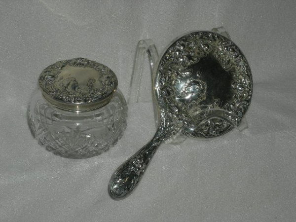 STERLING: F&B Sterling Silver Vanity Set Inc. Cut Glass Jar w/Lid Depicting Lady's Face w/Birds Surrounded By Highly Embossed Flowers, 3.5"T; Hand Mirror w/Matching Motif, 9.5"L.
