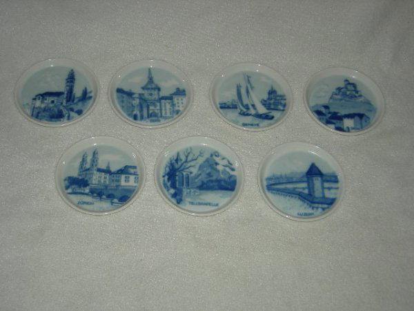PORCELAIN: 7 Swiss Langenthal Porcelain Coasters/Miniature Decorative Plates, Pierced For Hanging, Featuring Cities Of Switzerland Inc. Morcote, Zurich, Tellskapelle, Bern, Geneve, Sion, Luzern, 3.5"D.